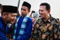 Ahok, right, greets people after arriving at the National Monument in Jakarta in 2014. A Christian and ethnic Chinese, ...