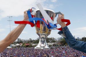 Easton Wood and Robert Murphy of the Bulldogs hold up the premiership cup. 