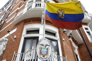 The Ecuadorian national flag flies outside their London Embassy, Tuesday, Oct. 18, 2016.