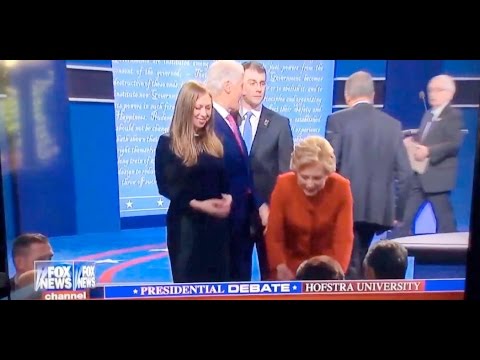 Mystery Man Removes Folder From Hillary Podium