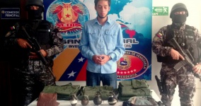 Opposition City Councilman Jose Vicente Garcia with confiscated grenades and military vests (Twitter/@VielmaEsTachira)