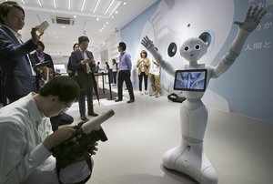 Humanoid Robots "Pepper" display at SoftBank Mobile shop in Tokyo, Friday, June 6, 2014. Japan's SoftBank Mobile Corp.