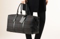 Burberry's carryall makes a stylish travel statement.