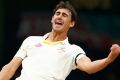 Mitchell Starc pumps his fist after dismissing Suresh Raina for a duck, the Indian's second of the match.