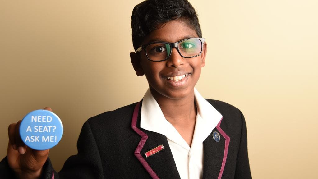 Last year’s 
<i>Great Australian Spelling Bee </i>winner Anirudh Kathirvel has come up with a badge which aims to give passengers with special needs more confidence to ask for a seat on public transport. Picture: Lawrence Pinder