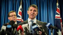 Mike Baird and Deputy Premier Troy Grant announce the greyhound racing reprieve on Tuesday.