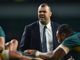 Australia's coach Michael Cheika watches his players warm up ahead of the Rugby Championship International test match between Argentina and Australia at Twickenham stadium in south west London on October 8, 2016. / AFP PHOTO / Glyn KIRK