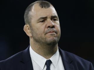 Australiaâ€™s head coach Michael Cheika watches as his team warms up prior to The Rugby Championship game between Argentina and Australia at Twickenham stadium in London, Saturday, Oct. 8, 2016. (AP Photo/Alastair Grant)