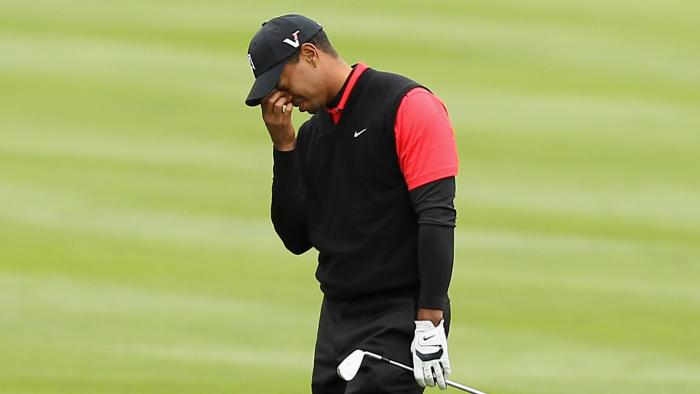 PEBBLE BEACH, CA - FEBRUARY 12: Tiger Woods reacts after hitting his second shot on the 14th hole during the final round of the AT&T Pebble Beach National Pro-Am at Pebble Beach Golf Links on February 12, 2012 in Pebble Beach, California. (Photo by Ezra Shaw/Getty Images)