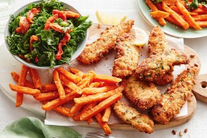 Pine nut crusted chicken with warm kale salad