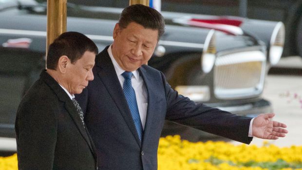 Come in to my parlour: Chinese President Xi Jinping, right, with Philippines President Rodrigo Duterte during a welcome ...