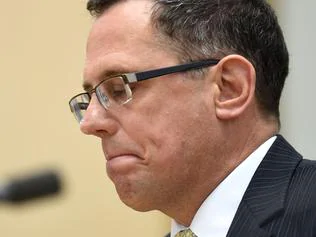 **FILE** An Oct. 14, 2016 file image of Australia's Solicitor-General Justin Gleeson appears before a Senate inquiry at Parliament House in Canberra. Solicitor-General Justin Gleeson has tendered his resignation following controversy over his relationship with Attorney-General George Brandis, Monday, Oct. 24, 2016. (AAP Image/Lukas Coch) NO ARCHIVING