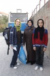 young girl with mother and sister infront of Pagani