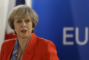 British Prime Minister Theresa May speaks to the media during the final press briefing at the EU Summit in Brussels, Friday, Oct. 21, 2016.