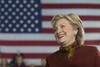 Democratic presidential candidate Hillary Clinton listens as vice presidential candidate Sen. Tim Kaine, D-Va. speaks during a campaign event at the Taylor Allderdice High School, Saturday, Oct. 22, 2016, in Pittsburgh, Pa.