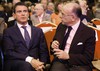 French Prime Minister Manuel Valls, right, and French Interior Minister Bernard Cazeneuve attend the speech of French President Francois Hollande, about democracy and terrorism as he looks ahead to a potential bid for a second term, Thursday Sept. 8, 2016 in Paris.