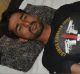 An injured Pakistani commando lies down on a bed at a local hospital.