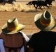 Horses race in Birdsville at an iconic outback event, started in 1882, that draws people from everywhere to the remote ...