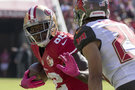 San Francisco wide receiver Torrey Smith (82) tries to get past Tampa Bay cornerback Brent Grimes on Sunday.