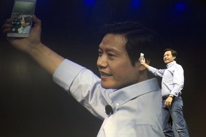 Lei Jun, chairman of Chinese smartphone maker Xiaomi, takes a selfie on the latest Xiaomi Note smartphone