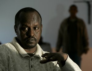 Somali refugee Mohamed Jama talks about the difficulties of assimilating to life in Kansas as he sits in a Somali restaurant he co-owns Friday, Dec. 21, 2007 in Emporia, Kan.