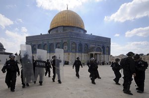 In this Oct. 5, 2012 file photo, Israeli forces take position during clashes with Palestinian worshippers at the Al-Aqsa Mosque compound in Jerusalem's Old City.