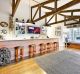 High celings and exposed beams are a feature of the home bar at 5-7 McFaralne Street, Montmorency, Victoria. 