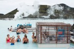 Tourists drinking and socialising at a pool bar in Iceland's Blue Lagoon.