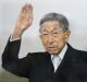 Japanese Prince Mikasa waves to well-wishers from a balcony during a New Year's public appearance at the Imperial Palace ...