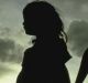 Silhouette of two girls holding hands child abuse