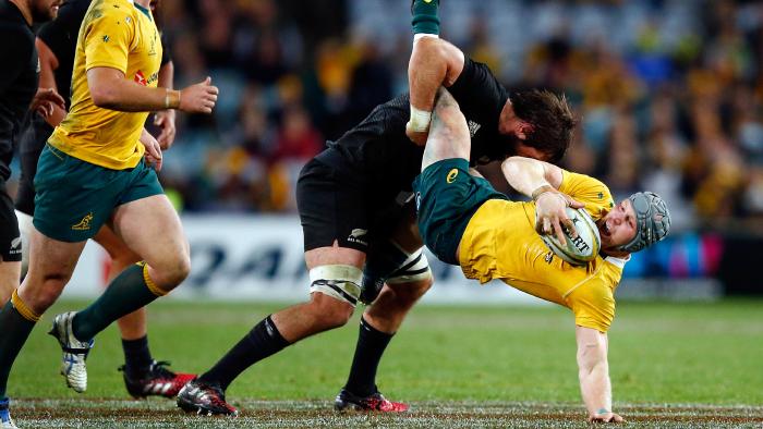 SYDNEY, AUSTRALIA - AUGUST 20: David Pocock of Australia is tackled during the Bledisloe Cup Rugby Championship match between the Australian Wallabies and the New Zealand All Blacks at ANZ Stadium on August 20, 2016 in Sydney, Australia. (Photo by Zak Kaczmarek/Getty Images)