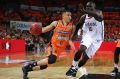 Travis Trice of the Taipans drives to the basket.