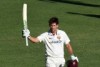 Joe Burns raises the bat after Sheffield Shield century