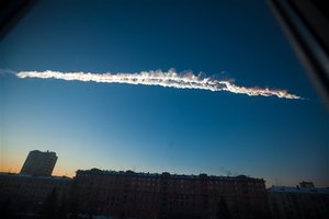 In this photo provided by Chelyabinsk.ru a meteorite contrail is seen over Chelyabinsk on Friday, Feb. 15, 2013. A meteor streaked across the sky of Russia’s Ural Mountains on Friday morning, causing sharp explosions and reportedly injuring around 100 people, including many hurt by broken glass.