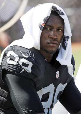 FILE - In this Sept. 20, 2015, file photo, Oakland Raiders defensive end Aldon Smith (99) cools off during an NFL football game against the Baltimore Ravens in Oakland , Calif. Every year, there are blue chippers carrying red flags. This season, the marketplace has Richie Incognito, Greg Hardy, Aldon Smith, Adam Jones, Andre Smith, Nick Fairley, Percy Harvin and Junior Galette. Lots of talent there, but plenty of locker room and off-field concerns, too. (AP Photo/Tony Avelar, File)