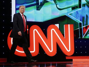 Republican presidential candidate, businessman Donald Trump enters the debate hall during the Republican presidential debate sponsored by CNN, Salem Media Group and the Washington Times at the University of Miami, Thursday, March 10, 2016, in Coral Gables, Fla.