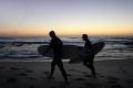 Surfers on Sydney's Bronte Beach last Saturday, which was sunny with warm temperatures.