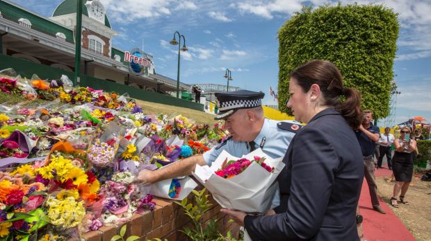 Queensland Premier Annastacia Palaszczuk and police assistant commissioner Brian Codd pay their respects at Dreamworld.