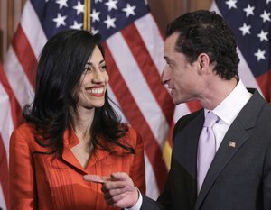 In this photo taken Jan. 5, 2011, then-New York Rep. Anthony Weiner and his wife, Huma Abedin, an aide to then-Secretary of State Hillary Clinton, are pictured after a ceremonial swearing in of the 112th Congress on Capitol Hill in Washington.