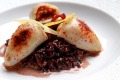 Slow cooking can tenderise squid. Pictured is a baby squid risotto from Ananas Bar and Brasserie in Sydney.