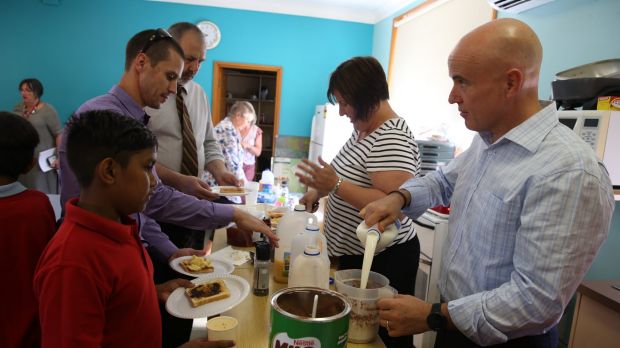 Education Minister Adrian Piccoli (right) at Walgett's breakfast club.