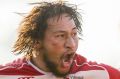 Sione Taula celebrates the Tuggeranong Vikings' Canberra grand final win.