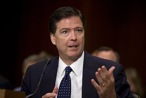 FBI Director nominee James Comey testifies on Capitol Hill in Washington, Tuesday, July 9, 2013, before the Senate Judiciary Committee hearing on his nomination. Comey spent 15 years as a federal prosecutor before serving in the George W. Bush administration, where he is best known for facing down the White House over a warrantless surveillance program.