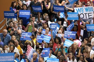 First Lady of the United States Michelle Obama speaking with supporters of former Secretary of State Hillary Clinton at a campaign rally at the Phoenix Convention Center in Phoenix, Arizona