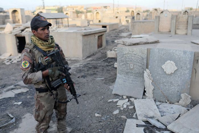 Iraqi soldier in Christian cemetary