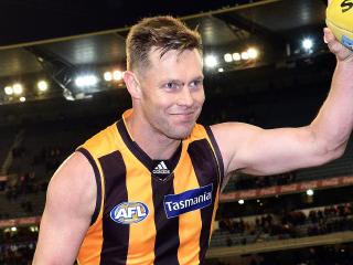 **FILE** A Sunday, July 24, 2016 image reissued Wednesday, Oct. 12, 2016 of Sam Mitchell of the Hawks leaving the ground after the Round 18 AFL match between the Hawthorn Hawks and the Richmond Tigers at the MCG in Melbourne. Hawthorn champion Sam Mitchell has delivered the biggest bombshell of AFL trade week, expressing interest in joining West Coast on a one-year playing contract, with a view to him securing a coaching gig with the Perth-based club after his playing career. (AAP Image/Julian Smith) NO ARCHIVING