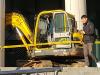 Man crashes digger in government protest