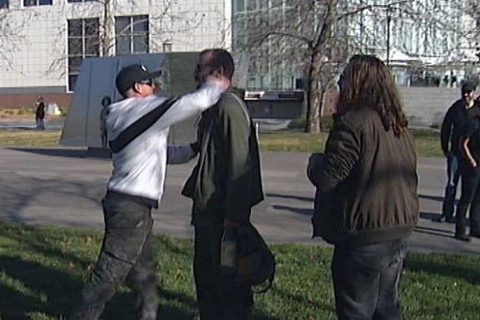 Reclaim Australia protester throws a punch at anti-racism activist post-rally in Canberra