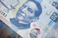 The currency fell 1.8 per cent, the most in almost four months, to 19.2088 per US dollar as of 12.37pm on Tuesday in ...