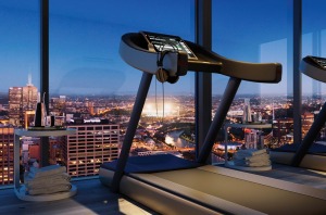 The gym at Collins House commands sweeping views over Melbourne.